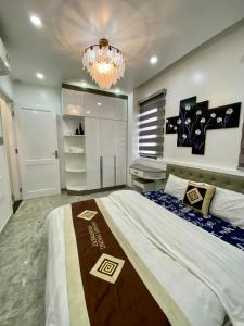 Säng eller sängar i ett rum på Khanh Phong Homestay Venice 21-12 Vinhomes Imperia