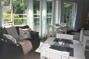 a living room with a couch and a table at Sabie Star in Sabie