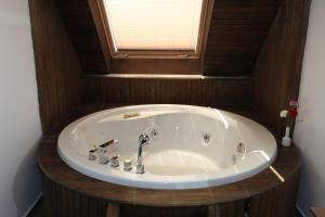 a bath tub in a bathroom with a window at Side Su Hotel - Adult Only (+16) in Side