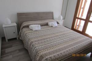 Łóżko lub łóżka w pokoju w obiekcie Villa Sapore di mare