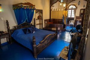 Postel nebo postele na pokoji v ubytování Zanzibar Palace Hotel