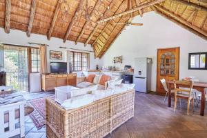 a living room with a couch and a table at 41 Ridge- self catering cottages in Midrand