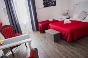 Posteľ alebo postele v izbe v ubytovaní Relais Cola Di Rienzo