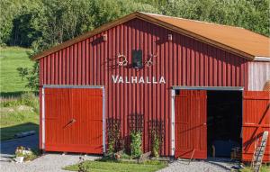 a red barn with the word valhalla written on it at 3 Bedroom Lovely Home In Nord-Statland in Nord-Statland +20 photos