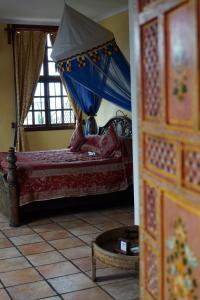 Postel nebo postele na pokoji v ubytování Zanzibar Palace Hotel