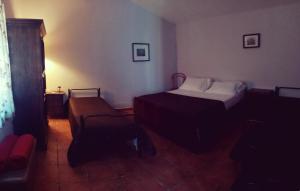מיטה או מיטות בחדר ב-Agriturismo Tre Santi
