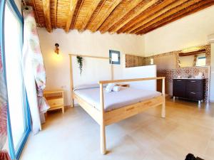 Postel nebo postele na pokoji v ubytování B&B La Nava Suites