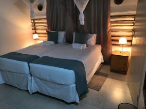 Postel nebo postele na pokoji v ubytování Leeville Guesthouse