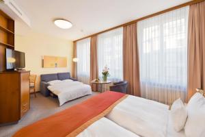 Letto o letti in una camera di Glärnischhof by TRINITY