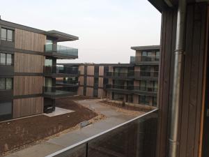 a view of an apartment building from a balcony at Appartement Daria Cossonay in Cossonay