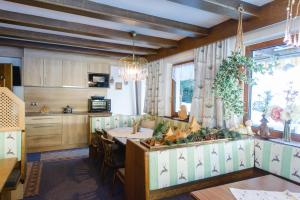 a kitchen and dining room with a table and chairs at Alpenheim Simone in Sölden