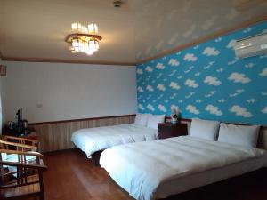 เตียงในห้องที่ Xiangcun Homestay