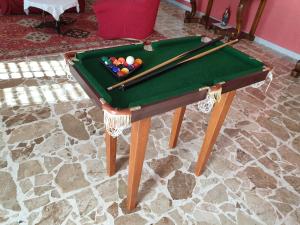 a pool table with balls and bats on it at B&B DA PERSIO in Macchiagodena