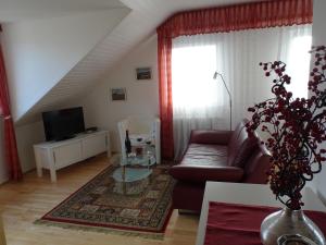 a living room with a couch and a table at Haus Holzheimer in Bad Kissingen