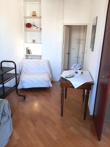 a small room with a table and a bed at Cannaregio apartment in Venice