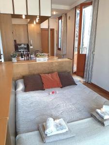 a bedroom with a large bed with towels on it at Cannaregio apartment in Venice