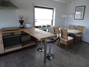a kitchen with a table and a dining room at Ferienwohnung Hoffmann in Osburg