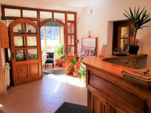 a kitchen with a wooden counter and a door at Hotel Gasperin Bohinj in Bohinj