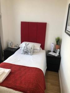 A bed or beds in a room at Trinity Guest House 