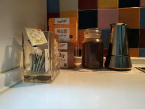 a counter with some items on a shelf at Abá apartamento in Almería