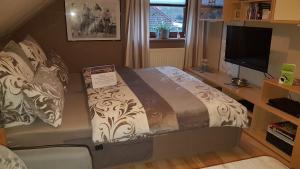 Postel nebo postele na pokoji v ubytování Pension Bütterich