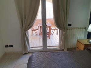 Postel nebo postele na pokoji v ubytování Guest House Brezza Marina