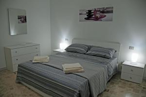 Casa Mia locazione turistica tesisinde bir odada yatak veya yataklar