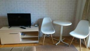 TV a/nebo společenská místnost v ubytování Liberta Apartment