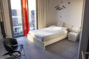 Katil atau katil-katil dalam bilik di PLANT BASED b&b central Bruges