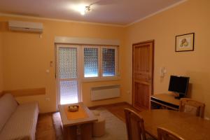 a living room with a couch and a table at Apartment Jadranka in Trebinje