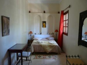 Voodi või voodid majutusasutuse Dar Nekhla toas