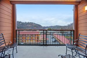 a balcony with chairs and a view of the mountains at Baskin's Creek Condos III in Gatlinburg
