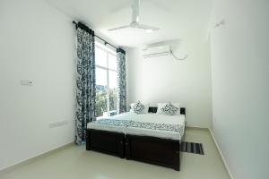 Letto o letti in una camera di RoaBaa Guesthouse