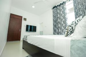 Letto o letti in una camera di RoaBaa Guesthouse