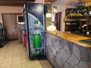 a refrigerator with a bottle of beer on it at Отель Виктория in Berezyna