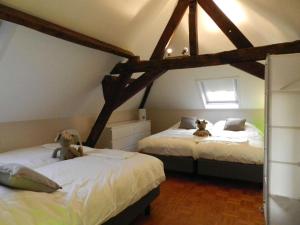 Säng eller sängar i ett rum på Apartment Het Blekershuys