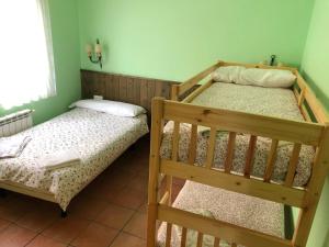 Posteľ alebo postele v izbe v ubytovaní Apartamentos rurales Casas de Haches