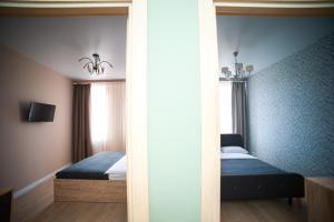 Posteľ alebo postele v izbe v ubytovaní 3 bedroom, 2 bathroom Apartment near Forum Lviv