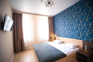 Posteľ alebo postele v izbe v ubytovaní 3 bedroom, 2 bathroom Apartment near Forum Lviv