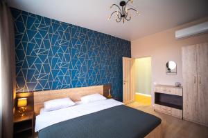 Posteľ alebo postele v izbe v ubytovaní 3 bedroom, 2 bathroom Apartment near Forum Lviv