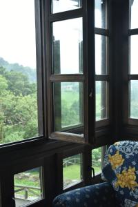 a view from a room with a chair and windows at La Casona de Torín in Torín