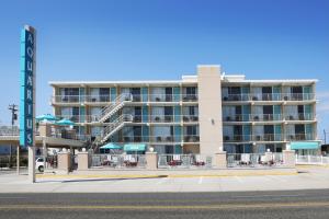 a hotel on the beach with a resort at Aquarius Oceanfront Inn in Wildwood +29 photos