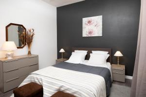 Säng eller sängar i ett rum på Les Terrasses Du Midi - Garage+Clim+WiFi