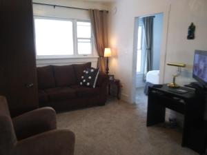 a living room with a couch and a window at Bright and Cool Powell Apartment in Powell