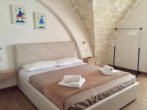 Giường trong phòng chung tại A Quattro di Mazze
