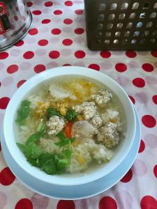 a bowl of soup sitting on a table at Khwanruen Fishing Resort in Ban Chang