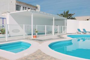 a swimming pool in the middle of a house at NEW ColonyClub in Puerto del Carmen