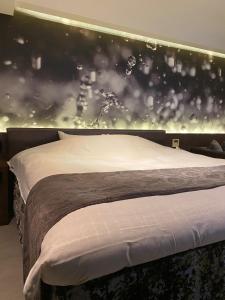 Rúm í herbergi á Hotel Regent (Adult Only)