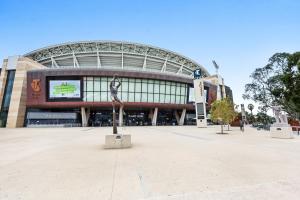 a stadium with a statue in front of it at Adelaide Style Accommodation - City to Beach - Free WIFI - Free 3 car parking - Great location in Adelaide