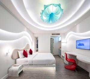 Ένα ή περισσότερα κρεβάτια σε δωμάτιο στο Avatara Resort